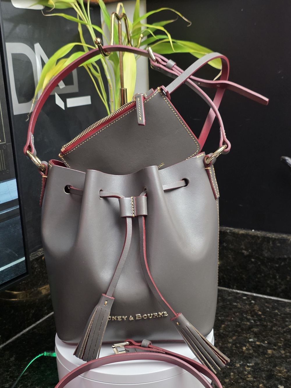 Dooney & Bourke Grey-Brown Drawstring Bucket Bag with Pink Trim